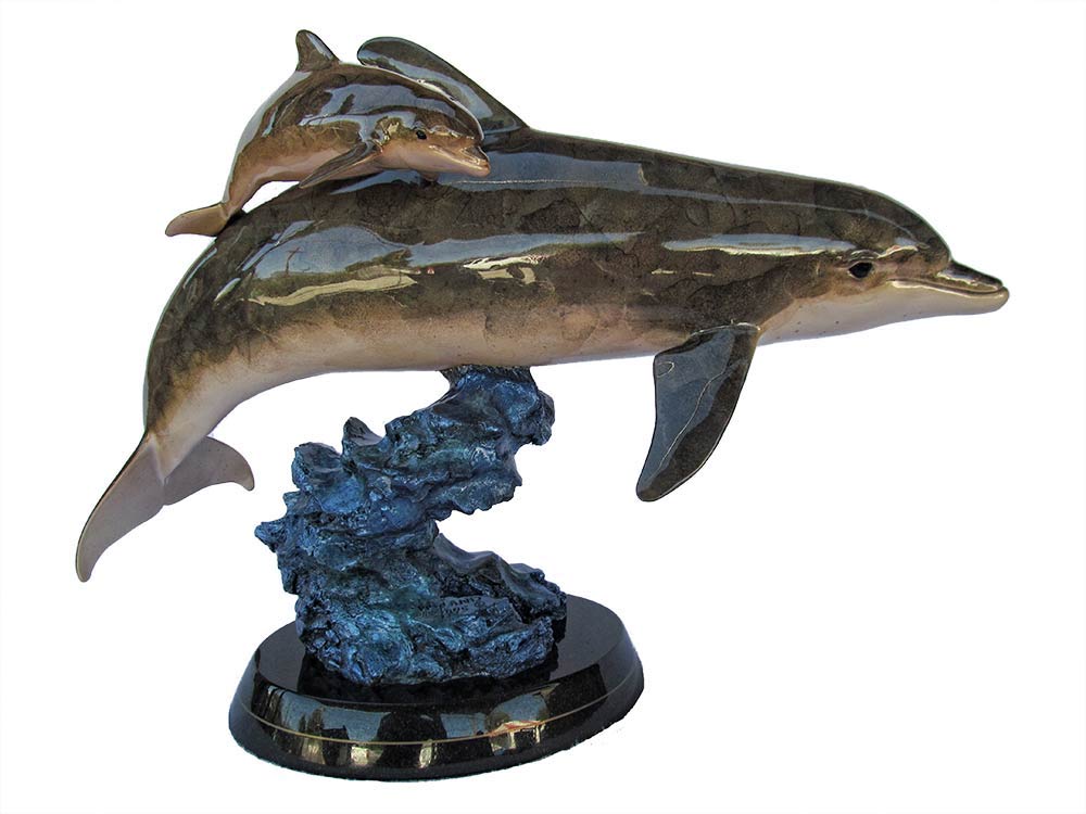 Sea Born a bronze dolphin sculpture by Wyland