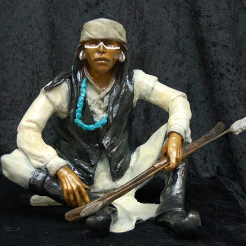 A Native American bronze sculpture titled White Mountain Apache by famous sculptor Marie Barbera
