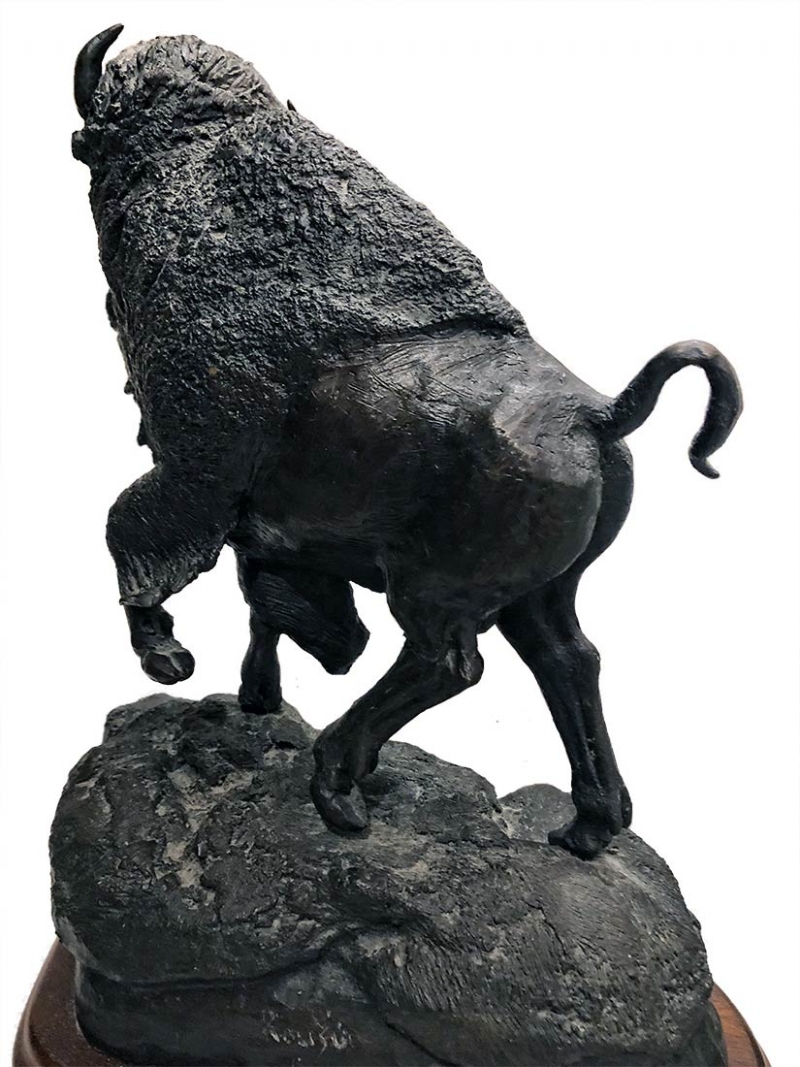 Buffalo bronze sculpture by R. Rousu available no on SculptureCollector.com where great sculpture is bought and sold R. Rousu bronze Buffalo sculpture